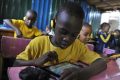 Des élèves dans une école de Nairobi, au Kenya, en 2015. © Simon Maina / AFP