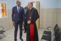 Dr Guy Patrick Obiang Ndong et le Cardinal Pietro Parolin, le 19 décembre 2022, dans la salle d'attente du Centre de santé Caritas. © D.R.