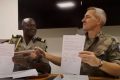 Poignée de main entre le colonel Bruno Eyi Ngui et le général François-Xavier Mabin, le 11 juillet 2023 à Libreville. © Capture d'écran/Gabon 1ère