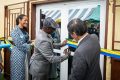 Le ministre de la Santé, le Pr Adrien Mougougou procédant à la mise en service de la chambre de stockage de vaccin, le 31 juillet 2024. © D.R.